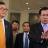 Cambodian Prime Minister Hun Sen (R) with Sam Rainsy (L)